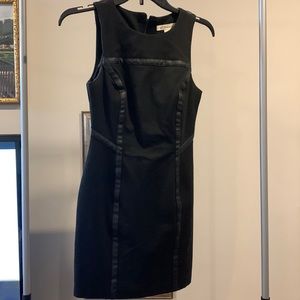 BCBG black mini dress form fitting with leather lining size 0